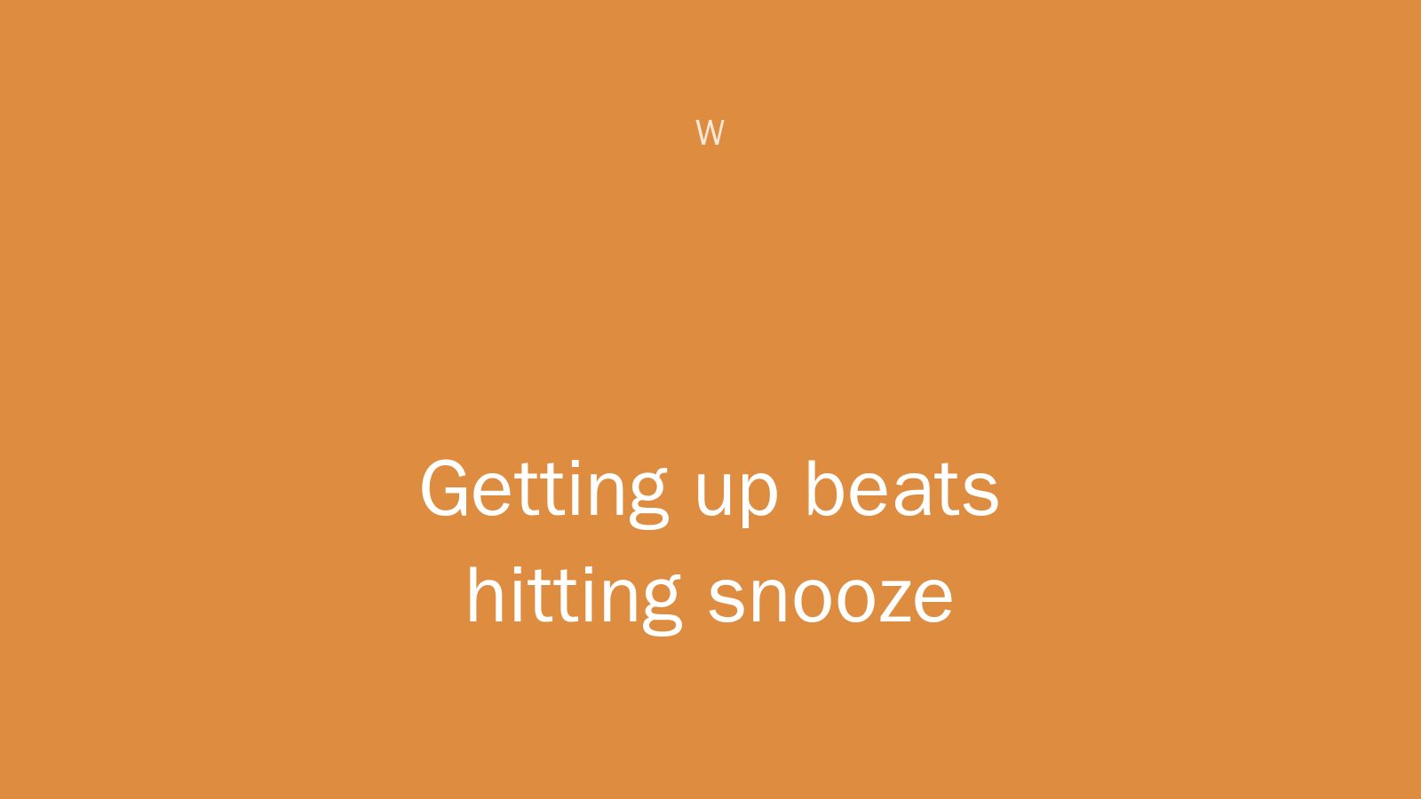 A hand reaching past a snooze button alarm clock toward a window with morning light